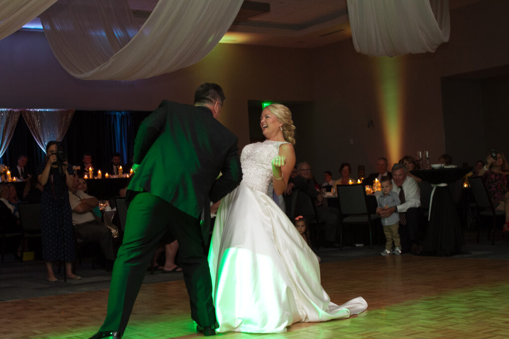 Wedding client happily dancing to music by the DJ